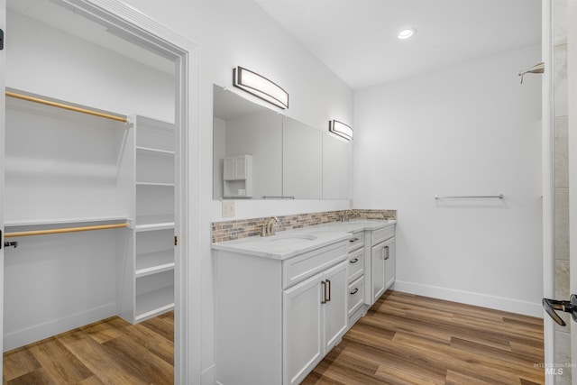 60 Appleford Ct, Asotin, WA 99402 - bathroom featuring vanity, wood finished floors, baseboards, tasteful backsplash, and recessed lighting