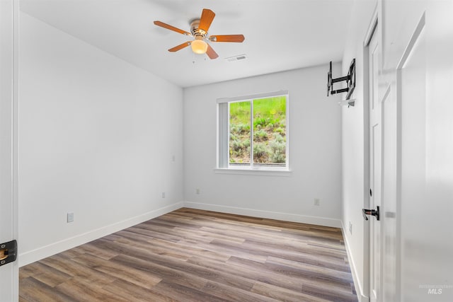 60 Appleford Ct, Asotin, WA 99402 - unfurnished bedroom with wood finished floors, baseboards, and a ceiling fan
