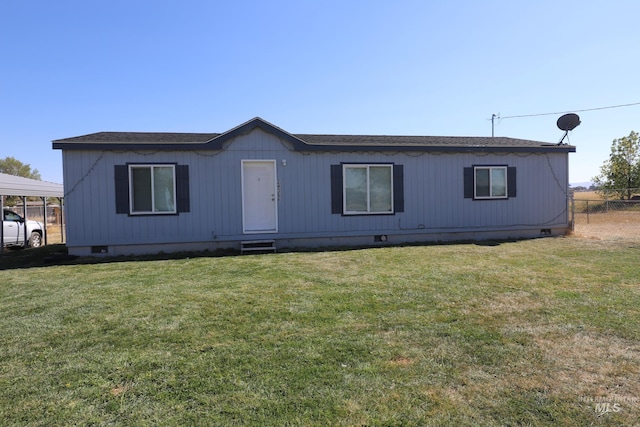 manufactured / mobile home with crawl space, a shingled roof, entry steps, and a front yard