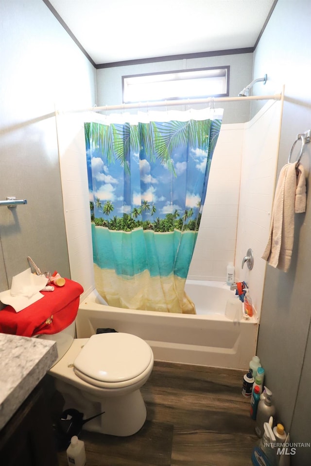 full bathroom featuring shower / bath combo, wood finished floors, vanity, toilet, and ornamental molding