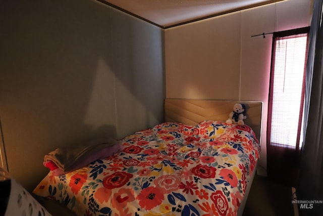 bedroom featuring multiple windows