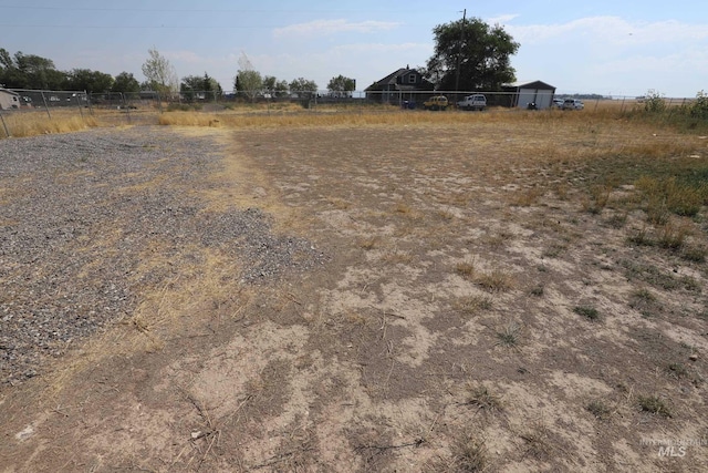 view of yard with a rural view