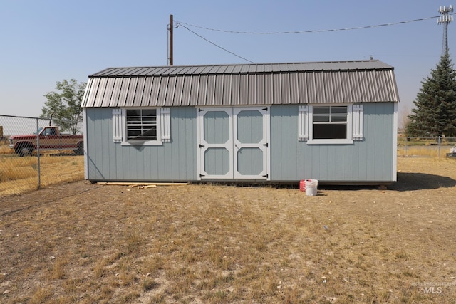 view of shed with fence
