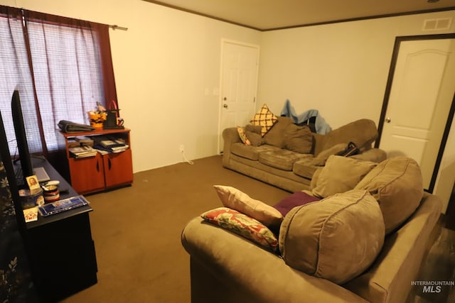 living area with visible vents and carpet flooring