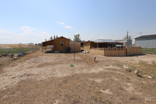 view of yard with a rural view