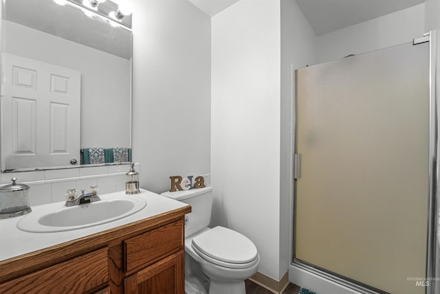 7842 Arlington Dr, Nampa, ID 83687 - full bath with toilet, a stall shower, vanity, and decorative backsplash
