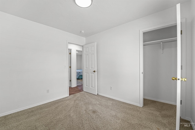 7842 Arlington Dr, Nampa, ID 83687 - unfurnished bedroom with carpet flooring, a closet, and baseboards