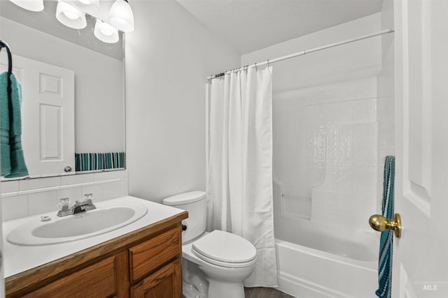 7842 Arlington Dr, Nampa, ID 83687 - bathroom featuring toilet, vanity, shower / bath combo, and backsplash