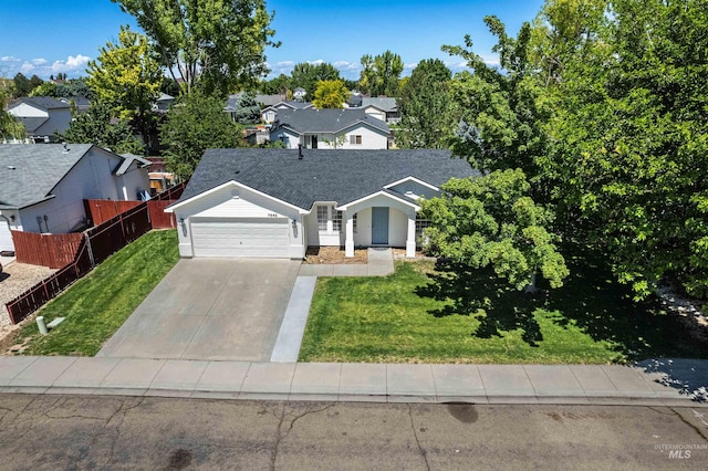 7842 Arlington Dr, Nampa, ID 83687 - ranch-style house with a garage, concrete driveway, and a residential view