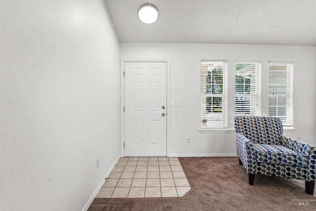 7842 Arlington Dr, Nampa, ID 83687 - entrance foyer with light carpet, light tile patterned floors, and baseboards