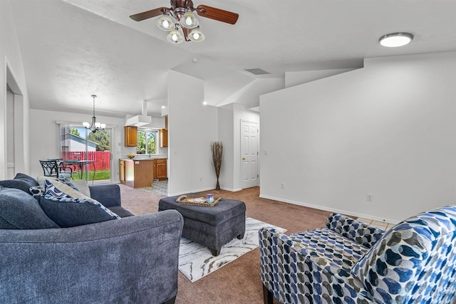 7842 Arlington Dr, Nampa, ID 83687 - living room with light colored carpet, a chandelier, a ceiling fan, vaulted ceiling, and baseboards