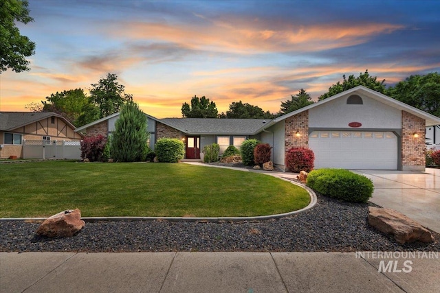 3428 N Columbine Ave, Boise, ID 83713 - view of front of property featuring a garage, driveway, and brick siding