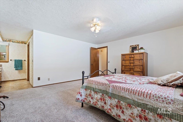 3428 N Columbine Ave, Boise, ID 83713 - carpeted bedroom with a textured ceiling, baseboards, and ensuite bathroom