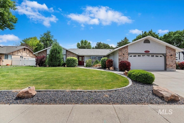 3428 N Columbine Ave, Boise, ID 83713 - view of front of property with a garage, concrete driveway, a front lawn, and brick siding