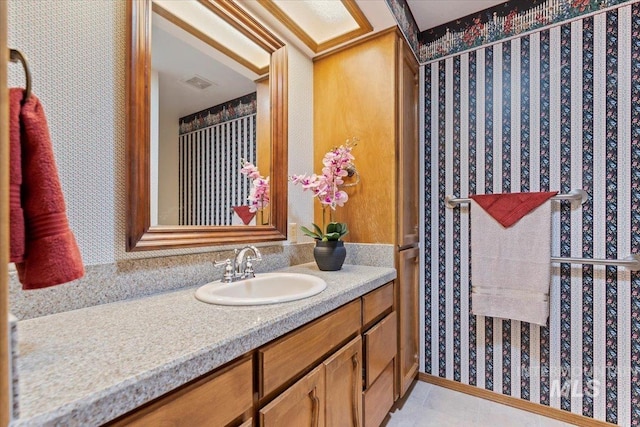3428 N Columbine Ave, Boise, ID 83713 - bathroom with vanity and wallpapered walls