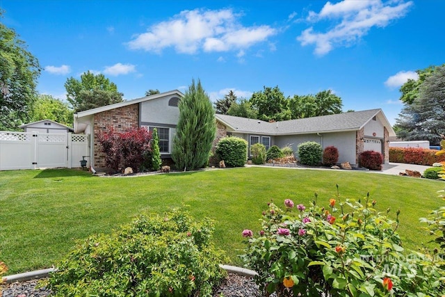 3428 N Columbine Ave, Boise, ID 83713 - view of front facade with an attached garage, stucco siding, and a gate