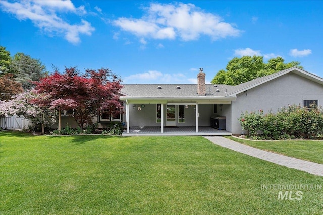 3428 N Columbine Ave, Boise, ID 83713 - rear view of property featuring stucco siding, a chimney, and a deck