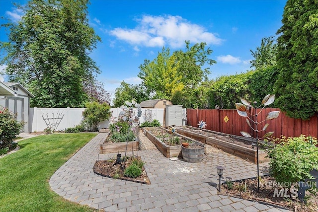 3428 N Columbine Ave, Boise, ID 83713 - view of patio / terrace featuring a garden and a storage unit