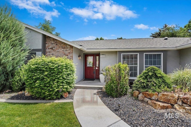 3428 N Columbine Ave, Boise, ID 83713 - entrance to property featuring stucco siding and a shingled roof