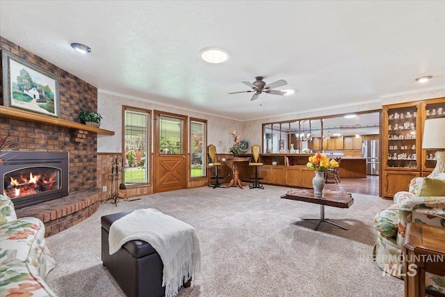 3428 N Columbine Ave, Boise, ID 83713 - living area featuring light colored carpet, crown molding, a ceiling fan, and a fireplace