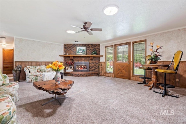 3428 N Columbine Ave, Boise, ID 83713 - carpeted living room with ceiling fan, crown molding, wainscoting, and a brick fireplace