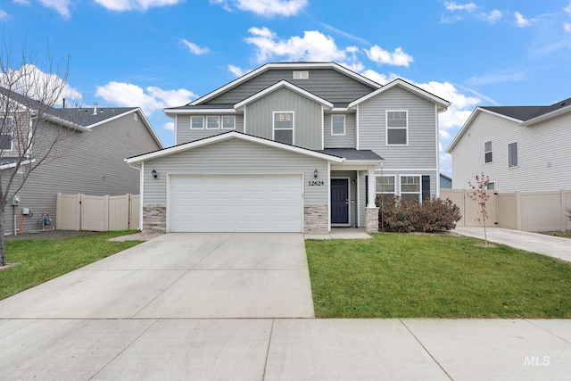 view of front of home featuring a front lawn and a garage