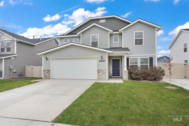 view of front of property featuring a front lawn and a garage