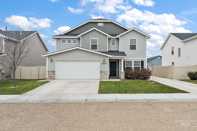 view of front facade with a garage and a front lawn