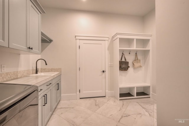 washroom featuring cabinets and sink