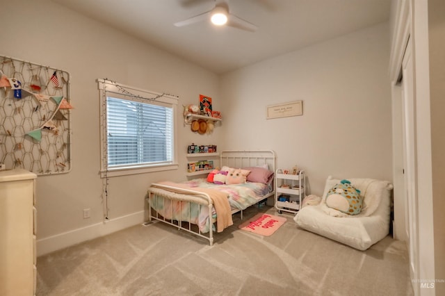 carpeted bedroom with ceiling fan