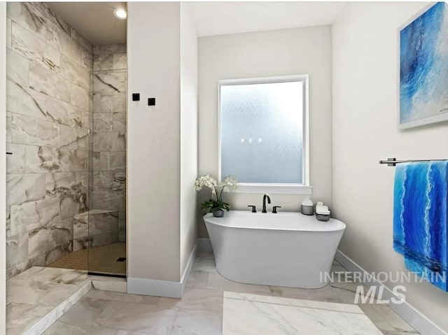 5207 W Kloe Ct Unit 808, Boise, ID 83714 - full bathroom featuring marble finish floors, a freestanding tub, baseboards, and a tile shower