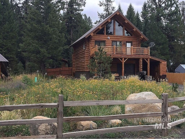 cabin with a wooden deck