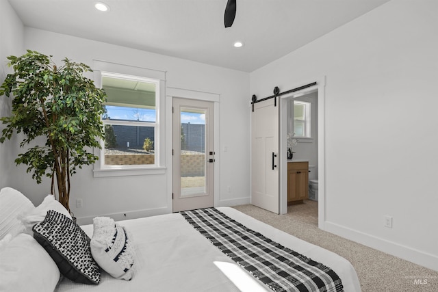 5687 S Snowden Ave, Meridian, ID 83642 - bedroom featuring baseboards, light colored carpet, a barn door, recessed lighting, and access to outside
