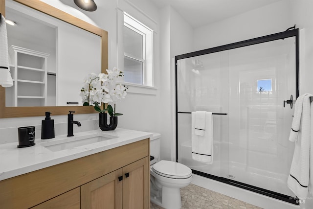 5687 S Snowden Ave, Meridian, ID 83642 - full bathroom featuring vanity, a shower stall, and toilet
