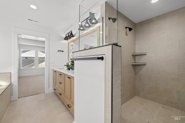 5687 S Snowden Ave, Meridian, ID 83642 - bathroom with vanity, visible vents, recessed lighting, walk in shower, and tile patterned floors