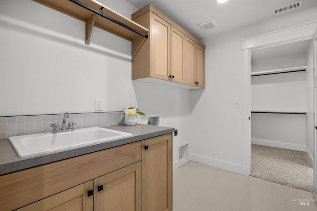 5687 S Snowden Ave, Meridian, ID 83642 - washroom featuring hookup for a washing machine, cabinet space, visible vents, and a sink