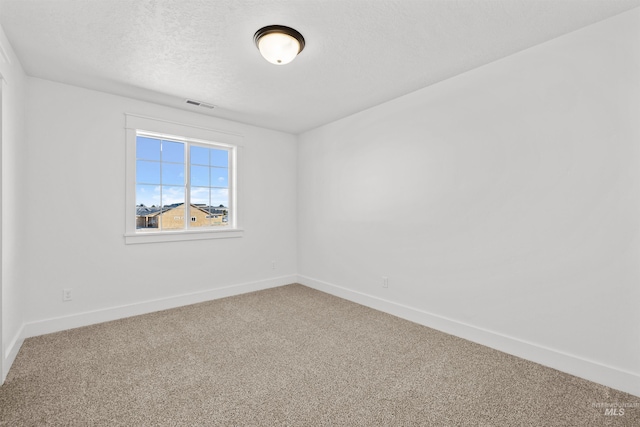 5687 S Snowden Ave, Meridian, ID 83642 - spare room featuring baseboards, visible vents, a textured ceiling, and carpet