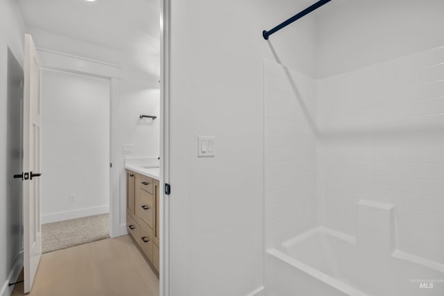 5687 S Snowden Ave, Meridian, ID 83642 - full bathroom featuring shower / bath combination, baseboards, and vanity