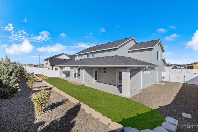 5687 S Snowden Ave, Meridian, ID 83642 - back of house with a residential view, a patio, a fenced backyard, and a gate