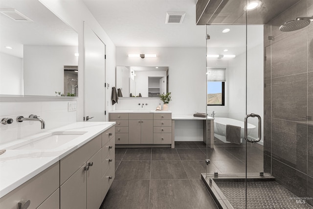 4135 N Hawkeye Pl, Boise, ID 83703 - bathroom with tile patterned floors, a shower stall, two vanities, and recessed lighting