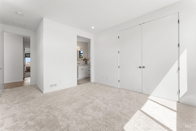 4135 N Hawkeye Pl, Boise, ID 83703 - unfurnished bedroom featuring carpet, ensuite bathroom, a closet, baseboards, and recessed lighting