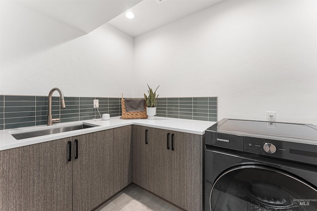 4135 N Hawkeye Pl, Boise, ID 83703 - laundry room with washer / dryer, a sink, and recessed lighting