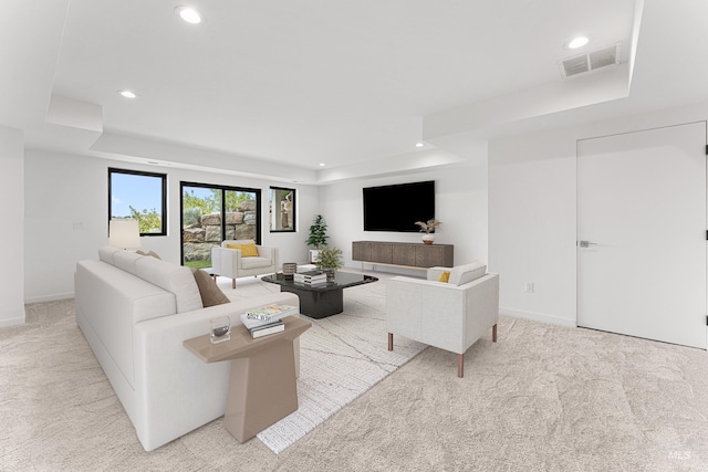 4135 N Hawkeye Pl, Boise, ID 83703 - living room featuring a tray ceiling, light carpet, recessed lighting, and baseboards