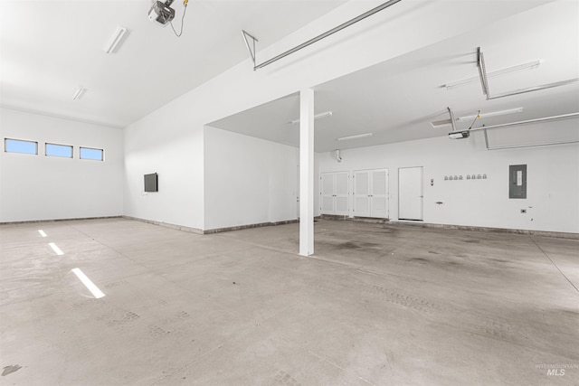 4135 N Hawkeye Pl, Boise, ID 83703 - garage with a garage door opener, electric panel, and baseboards