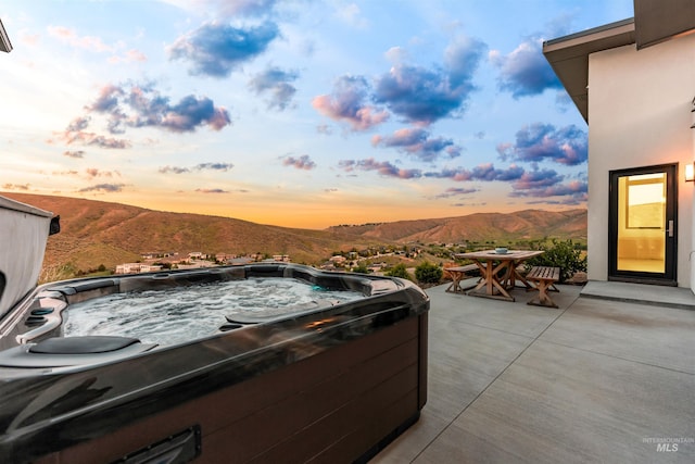 4135 N Hawkeye Pl, Boise, ID 83703 - view of patio with a hot tub, a mountain view, and outdoor dining area