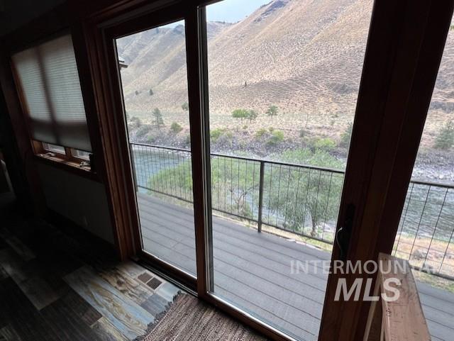 doorway to outside featuring hardwood / wood-style floors