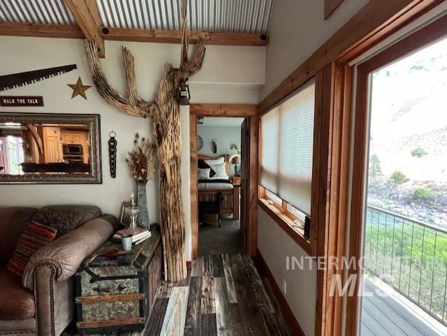 sunroom with beamed ceiling