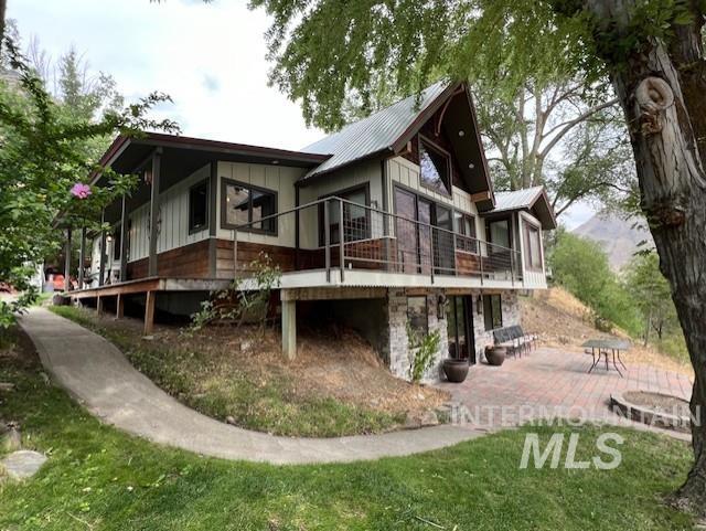 back of property featuring a patio area