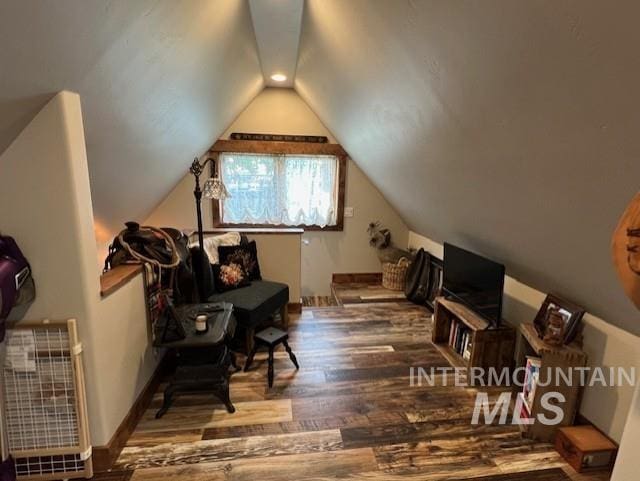 bonus room featuring vaulted ceiling and wood-type flooring