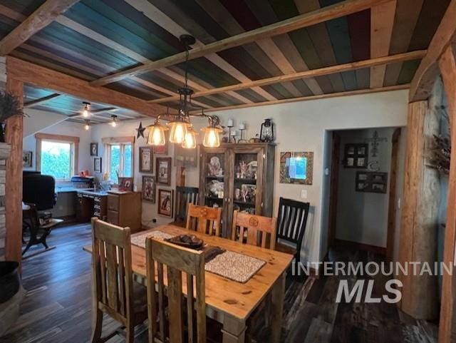 dining area with dark hardwood / wood-style flooring, beamed ceiling, and ceiling fan